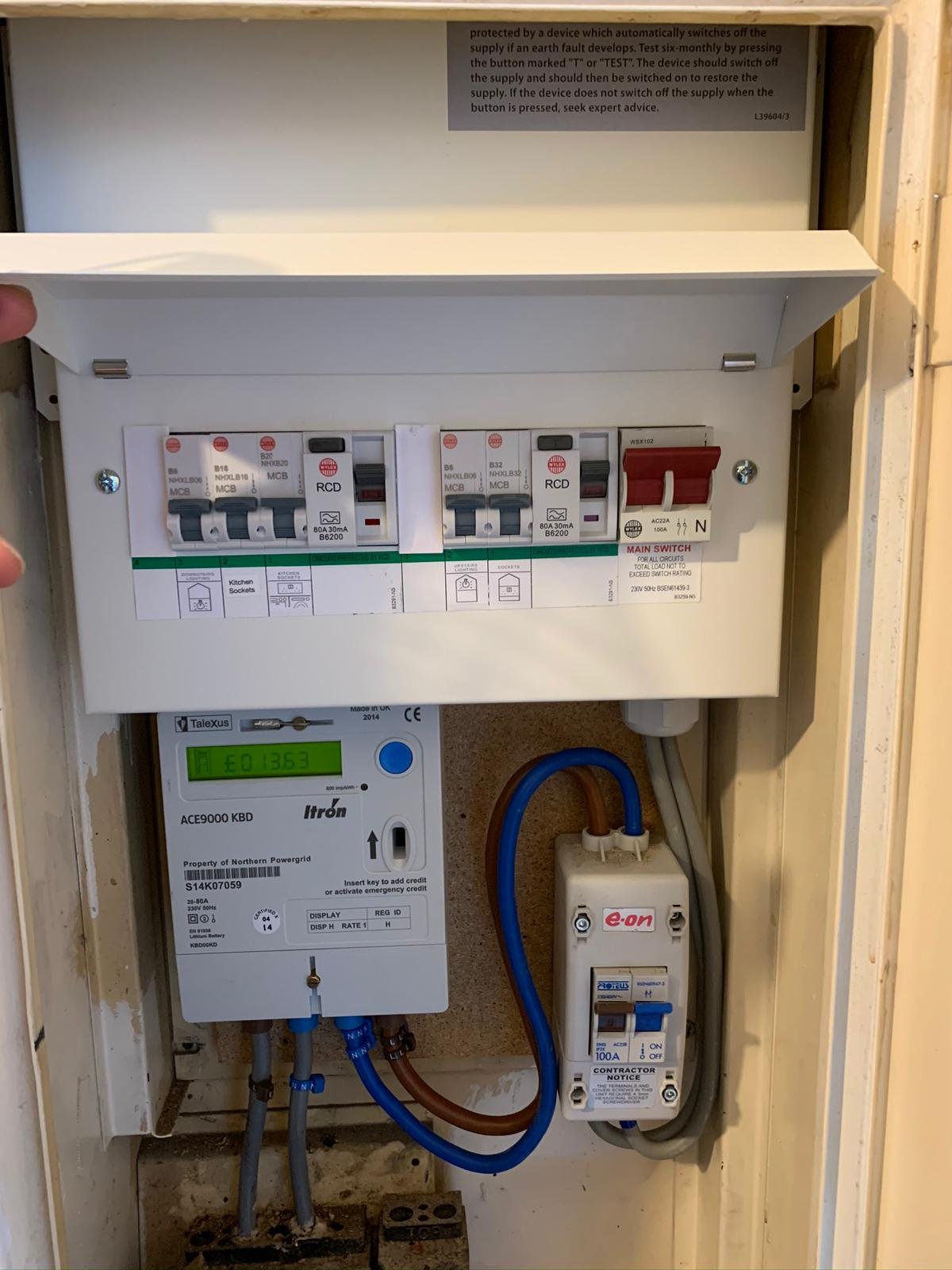 Close-up of a domestic fuse box / consumer unit needing repair