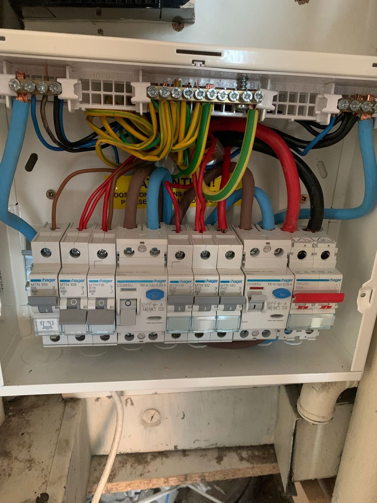 Electrician rewiring a North London property