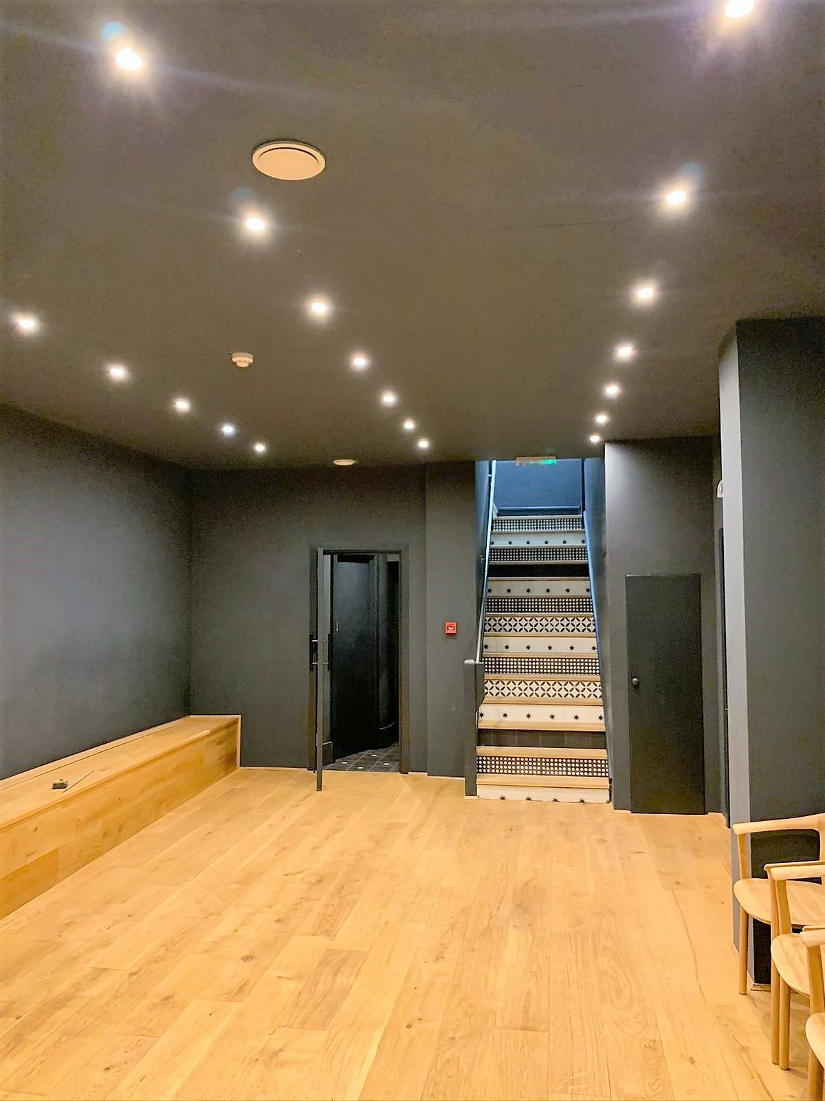 Commercial electrician carrying out planned office electrical maintenance